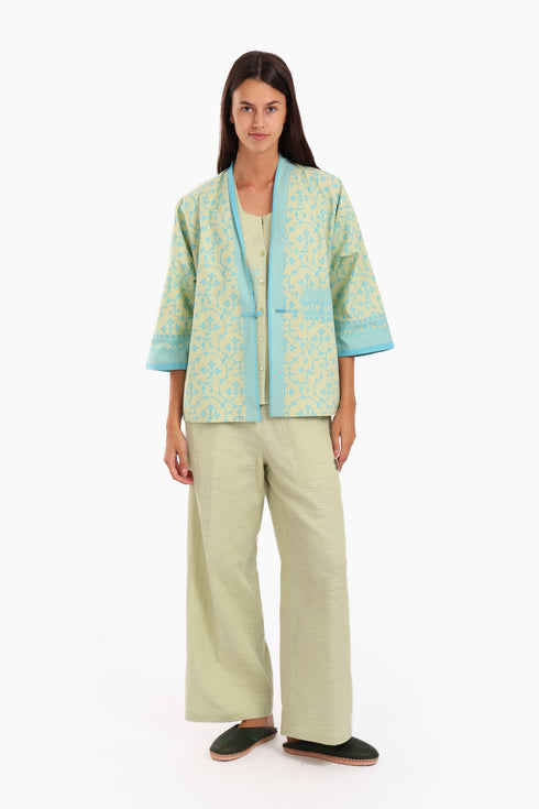 Short jacket in printed cotton with one front button and side slits
